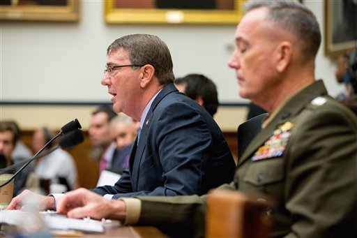 Defense Secretary Ash Carter, left, accompanied by Joint Chiefs Chairman Gen. Joseph Dunford Jr., testifies on Capitol Hill in Washington on Tuesday, Dec. 1, 2015, before the House Armed Services Committee hearing on the U.S. Strategy for Syria and Iraq and its Implications for the Region.
