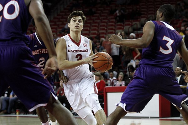 Arkansas' Dusty Hannahs (3) drives into the key during the first half of an NCAA college basketball game against Northwestern State, Tuesday, Dec. 1, 2015, in Fayetteville, Ark. (AP Photo/Samantha Baker)