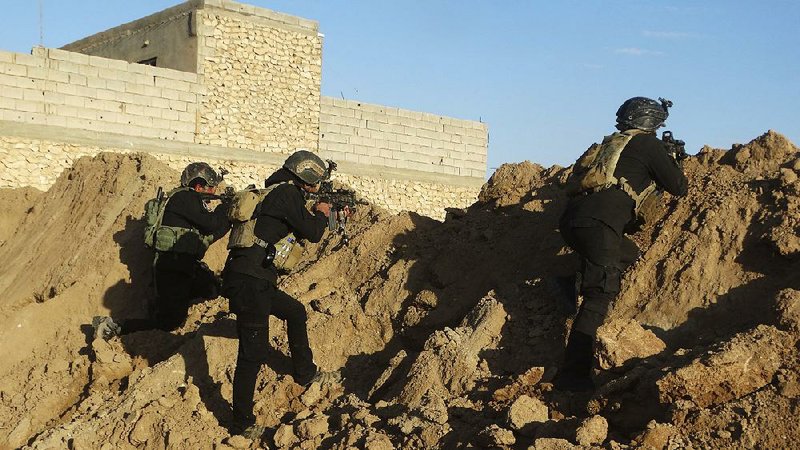 Iraqi security forces take position Monday around Ramadi, Iraq, ahead of a planned push against Islamic State militants. 