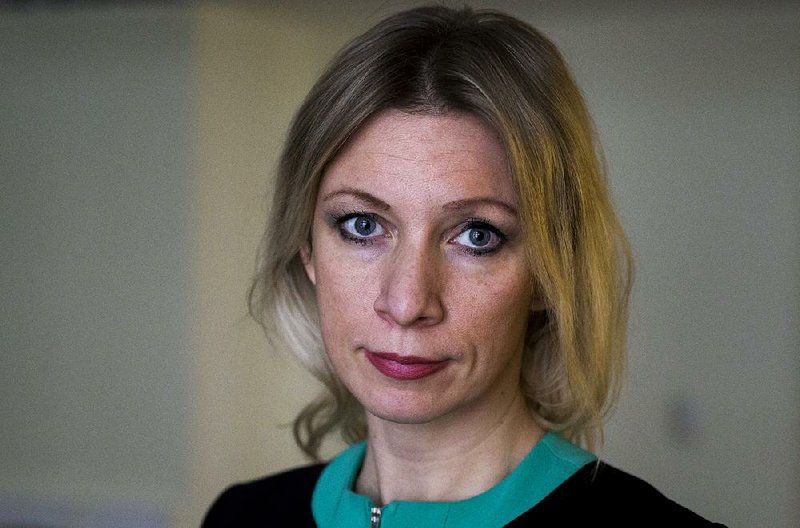 Russian Foreign Ministry spokeswoman Maria Zakharova listens for a question during her interview to the Associated Press in Moscow, Russia, Tuesday, Dec. 1, 2015.  