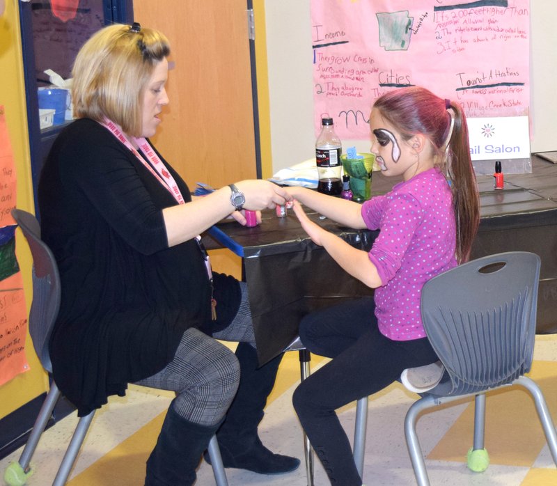 Photo by Mike Eckels One of the many youngsters gets her nails done during the Nov. 13 Decatur Northside Elementary School annual Fall Festival fundraiser.