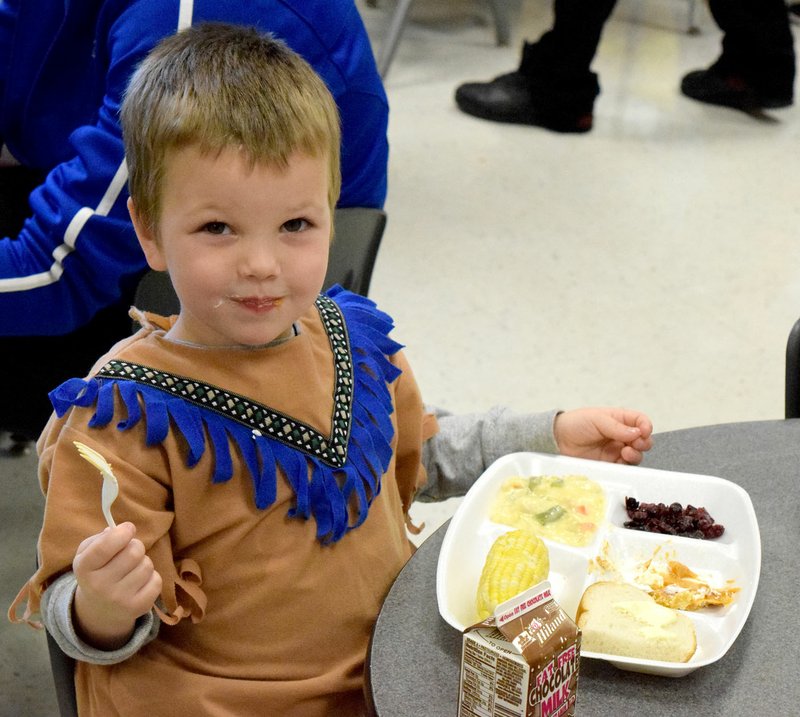 Photo by Mike Eckels Landon Webb takes a bit of his chicken pot pie during Joyce Turnage&#8217;s second grade class Thanksgiving feast at Decatur Northside Elementary Nov. 24.