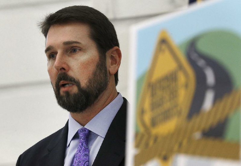 Arkansas Highway Department Director Scott Bennett speaks at a news conference at the Arkansas state Capitol in Little Rock, Ark., Tuesday, Jan. 6, 2015. 