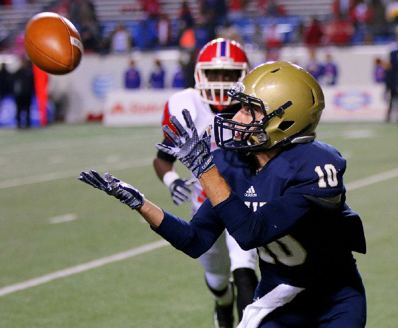 Pulaski Academy wide receiver Zack Kelley (10) catches a touchdown pass in front of a Little Rock McClellan defender with 11 seconds left in the fourth quarter of Friday’s night’s Class 5A state championship game at War Memorial Stadium in Little Rock. The Bruins held the Lions scoreless in the second half after battling back from a 30-29 halftime deficit to win their second consecutive title. Kelley accounted for 172 yards of total offense and four touchdowns as Pulaski Academy finished the season 14-0. For more photos of the game, visit arkansasonline.com/galleries.

