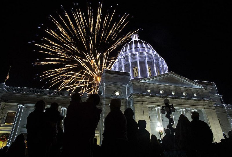 Visitors watch fireworks Dec. 5, 2015, during the annual holiday lighting ceremony at the state Capitol in Little Rock. The ceremony followed the city’s holiday parade. 