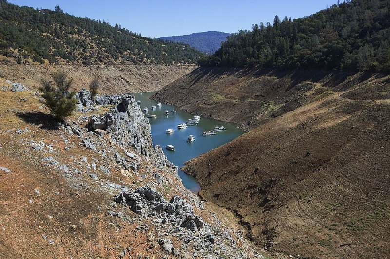 Boats vie for space in September in Lake Oroville in Northern California, where lake levels have dropped 254 feet. The drought has exposed hundreds of archaeological sites around Oroville and other lakes. 