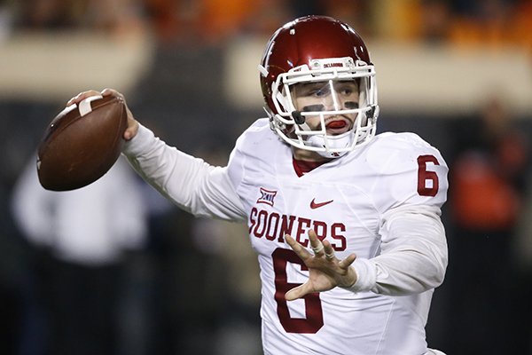 Oklahoma quarterback Baker Mayfield (6) passes in the second quarter of an NCAA college football game against Oklahoma State in Stillwater, Okla., Saturday, Nov. 28, 2015. (AP Photo/Sue Ogrocki)