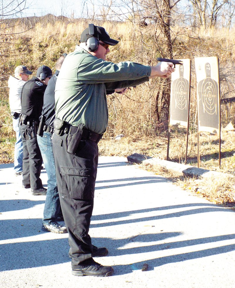 Shooting qualification rounds with other Gentry police officers on Dec. 2 was Joe Gregory, a newly hired police officer for the city. He scored 485 points out of a possible 500, or a 97 percent, and was the top shooter at the qualification rounds on the Gentry Police Department range last week Wednesday.