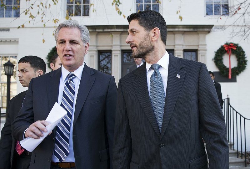 House Majority Leader Kevin McCarthy (left) and House Speaker Paul Ryan leave a news conference Tuesday at which Ryan denounced GOP presidential candidate Donald Trump’s call Monday for blocking Muslims from entering the United States. 