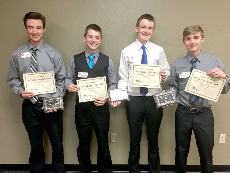 Submitted Photo Derek German, Braxton Gunneman, Kyle Killgore and Clay Wills, students in the entrepreneurship class at Gentry High Schhol, show the certificates and awards they won in the Business Opportunities for Success project at the North Arkansas College in Harrison on Nov. 18. The team took first in the competition against 15 other schools with its simulated business model.