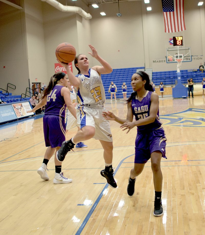 Photo courtesy of JBU Sports Information John Brown junior point guard Kodee Powell, of Green Forest, drives in for a basket in the second half against Southwestern Assemblies of God (Texas) on Saturday at Bill George Arena.