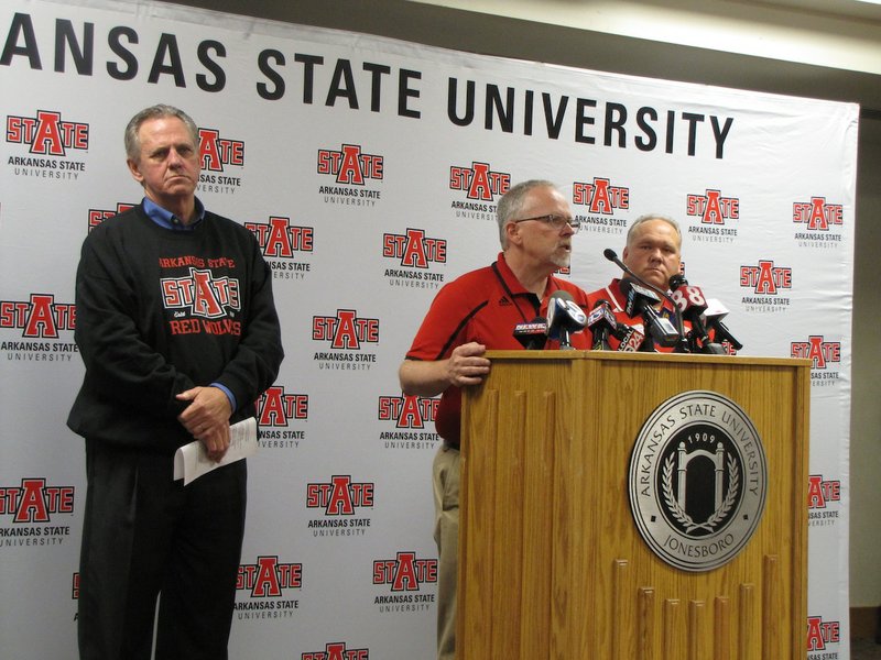 Arkansas State University spokesman Bill Smith introduces Chancellor Tim Hudson (left) and Randy Martin, chief of university police (right), during a news conference Thursday, Dec. 10, 2015. Officials spoke on a gunman who drove a truck onto the university's campus earlier in the day, brandishing a weapon. No injuries or gunshots were reported.