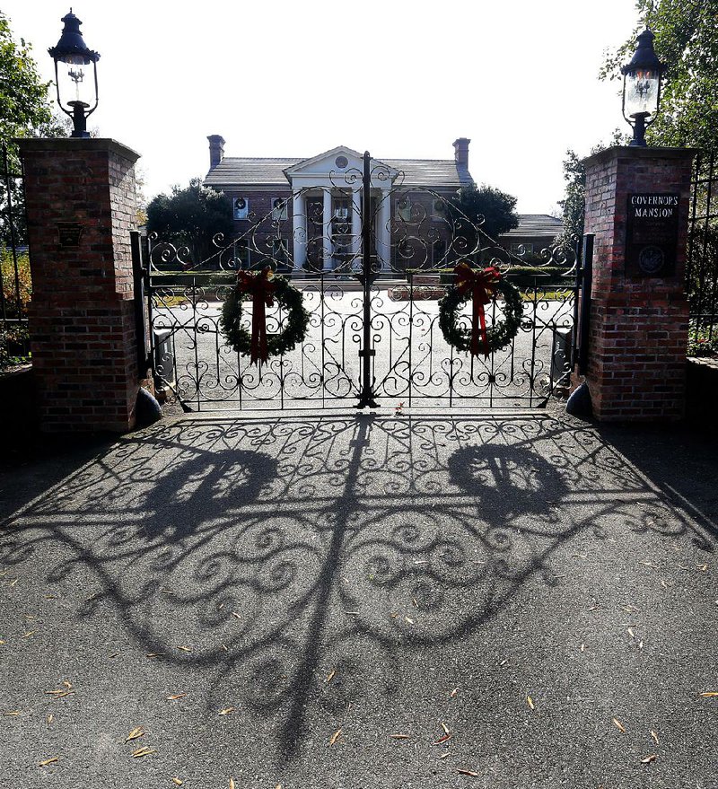 Gov. Asa Hutchinson has requested $500,000 to upgrade the security system at the Governor’s Mansion, shown Thursday behind the front gate.