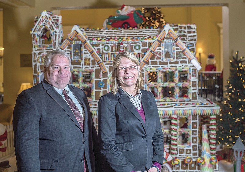 Scott Francis, director of food and beverage at the Arlington Hotel and Spa in Hot Springs, and Carmen Jones, front-desk manager, were instrumental in creating this year’s gingerbread house, which sits in the hotel lobby. They used a wide variety of candy to decorate the house and invite visitors to guess the number of pieces it took to cover this three-story creation.
