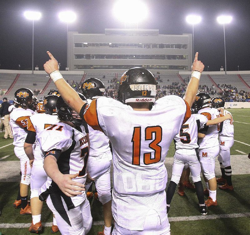 McCrory quarterback Cade Campbell celebrates in the closing seconds of the Jaguars’ victory over Rison in the Class 2A state championship game at War Memorial Stadium in Little Rock. McCrory, which did not field a varsity team in 2003 and 2004 because of low numbers, won its first state title. 
