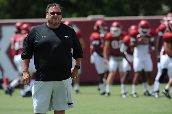 Arkansas assistant coach Sam Pittman watches Saturday, Aug. 8, 2015. during practice at the university football practice field in Fayetteville.