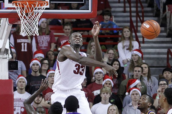 Arkansas' Moses Kingsley (33) blocks a shot during the first half of an NCAA college basketball game against Tennessee Tech, Saturday, Dec. 12, 2015, in Fayetteville, Ark. (AP Photo/Samantha Baker)
