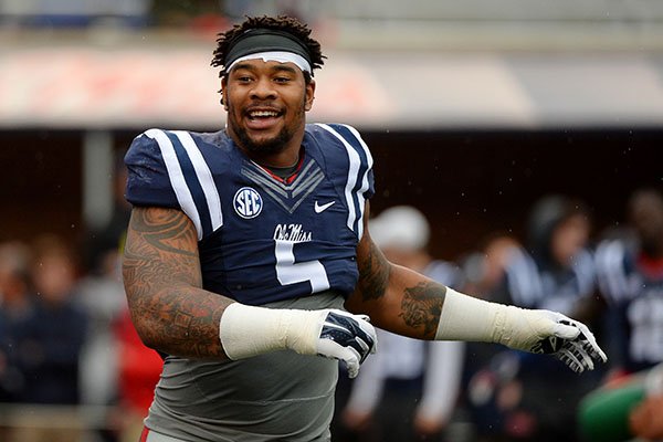  In this Nov. 7, 2015, file photo, Mississippi defensive tackle Robert Nkemdiche stretches before an NCAA college football game against Arkansas in Oxford, Miss. (AP Photo/Thomas Graning, File)