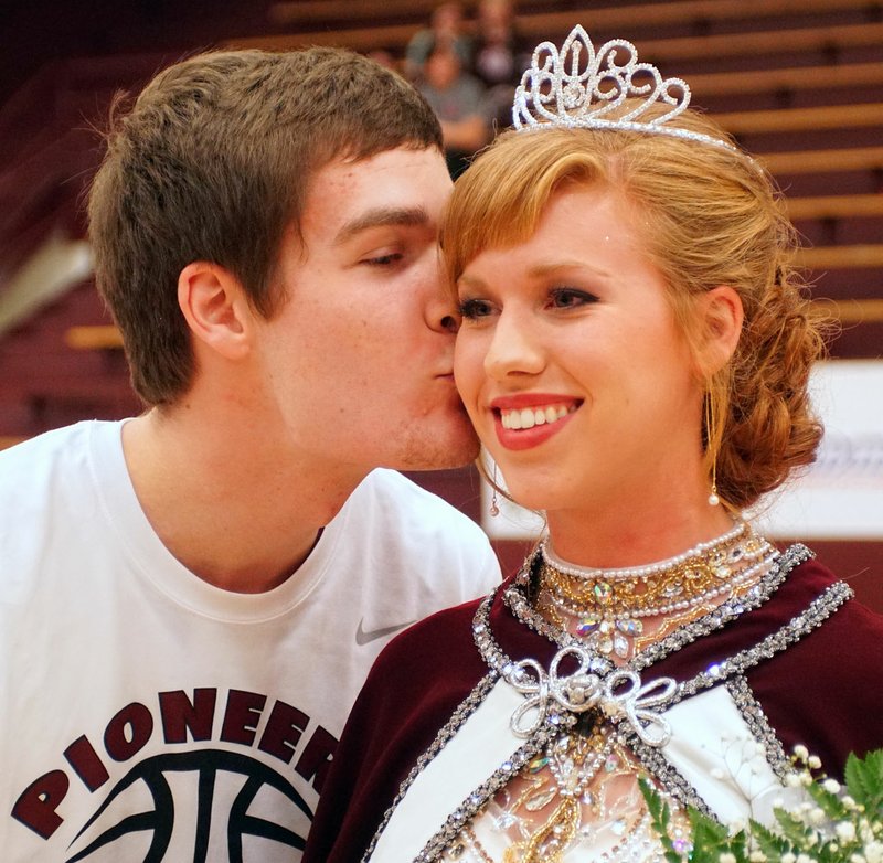 Photo by Randy Moll Matt Juillerat, colors&#8217; day king, kisses Mallory Morris, colors&#8217; day queen, at Gentry High School ceremonies on Friday night.