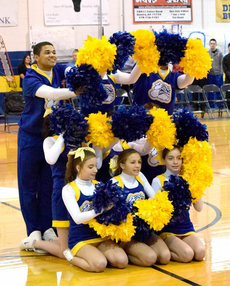 Photo by Mike Eckels The Decatur High cheer team forms the &quot;S&quot; in it&#8217;s D.H.S. (Decatur High School) cheer the team performed at the 2015 Colors Day pep rally at Peterson Gym in Decatur Dec. 12.