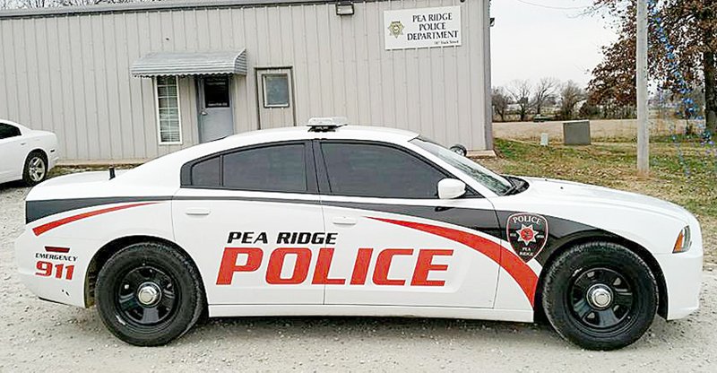 Photograph submitted Several Pea Ridge Police cars have a new look thanks to First Place Graphics, according to Police Chief Ryan Walker, who said the new look ties in the city and school with the school colors, a Blackhawk and a cannon in the design. &#8220;The majority of the graphics are reflective so there&#8217;s no mistaking us at night,&#8221; Walker said. Four cars of the 13 in the fleet have been restriped.