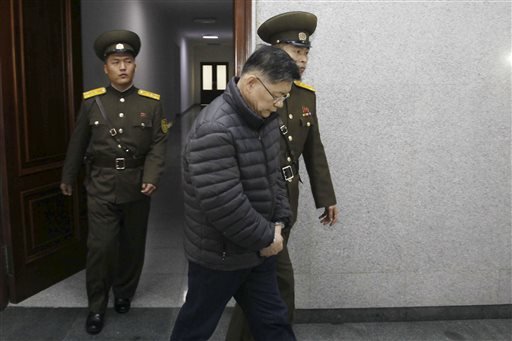 Hyeon Soo Lim, center, who pastors the Light Korean Presbyterian Church in Toronto, is escorted to his sentencing in Pyongyang, North Korea, on Wednesday, Dec. 16, 2015. 