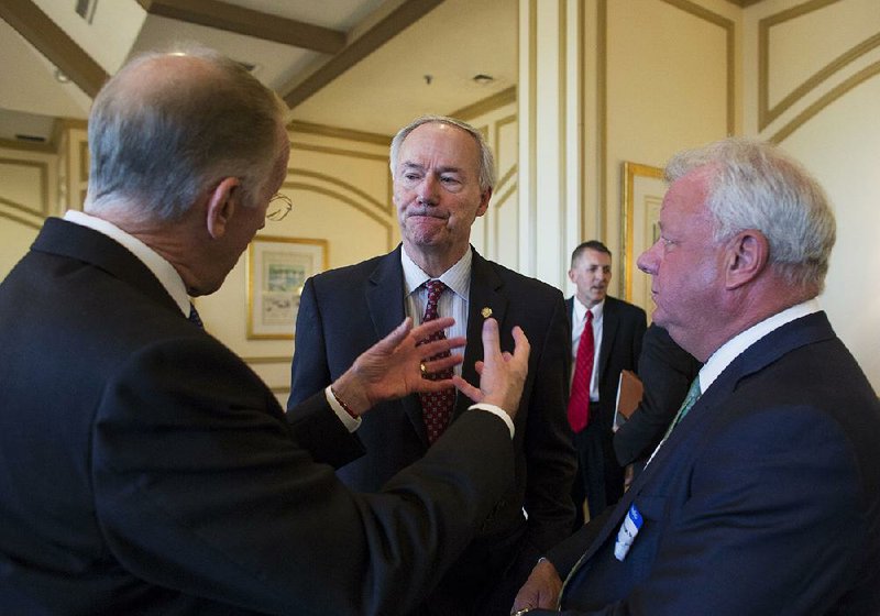 Governor Asa Hutchinson speaks to supporters gathered to hear the announcement of a partnership with non profit and nonpartisan organization Arkansas Policy Foundation December 17, 2015 at the Little Rock Club. Hutchinson said the Cuban government has ordered 4,500 tons of poultry from Arkansas companies to be shipped in January.