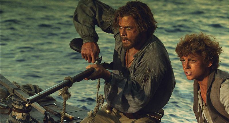 Chris Hemsworth (left) and Tom Holland star in the new action adventure film In the Heart of the Sea. It came in second at last weekend’s box office and made about $11 million.