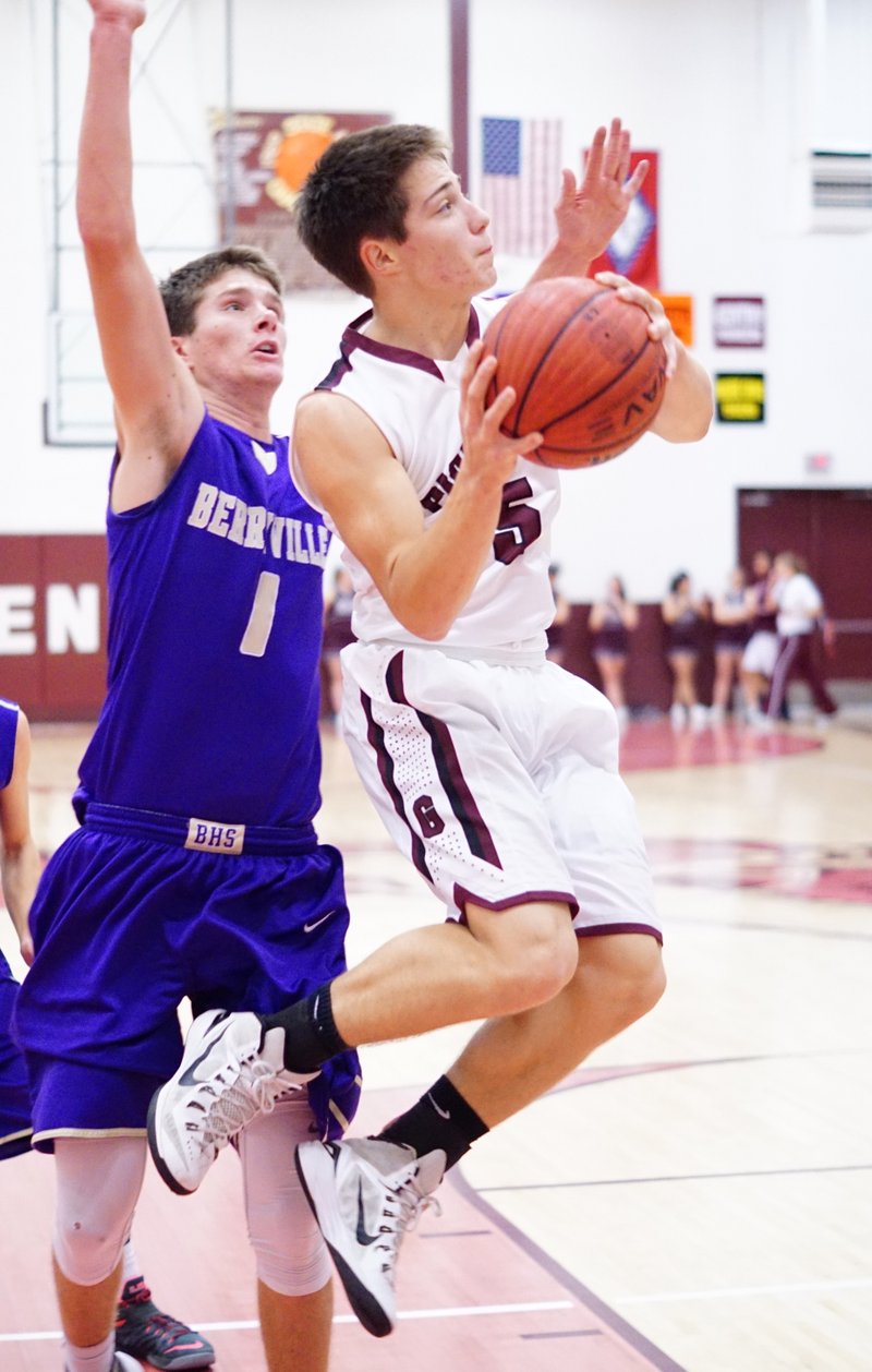 Cole Cripps, Gentry junior, broke through Berryville's defense to shoot for two under the basket during play in Gentry on Thursday night.