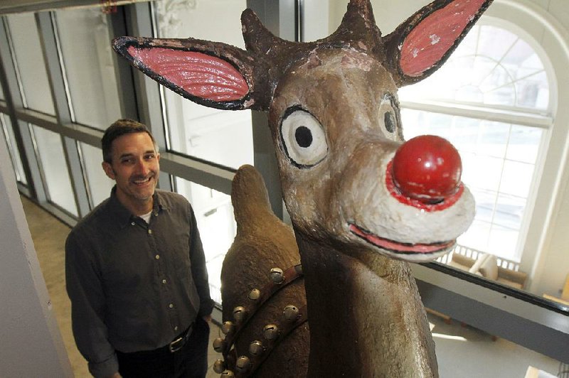 Special Collections curator Frank Fittizio stands beside the original Rudolph the Red-Nosed Reindeer, bought by Crystal Bridges from the estate of author/creator Robert Lewis May for $12.4 million.