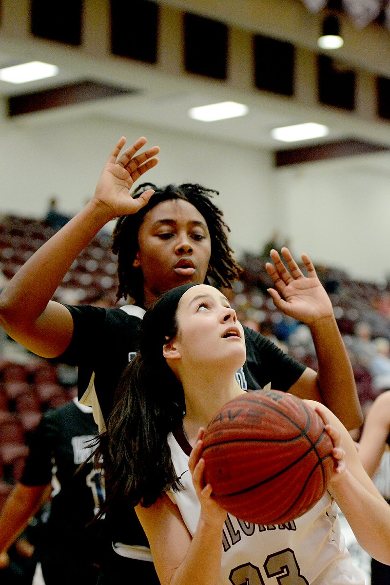 Bud Sullins/Special to Siloam Sunday Siloam Springs sophomore Hadlee Hollenback looks for the shot as Tulsa (Okla.) Webster&#8217;s Jordan Ward defends during the Lady Panthers&#8217; 78-23 victory on Tuesday at Panther Activity Center.