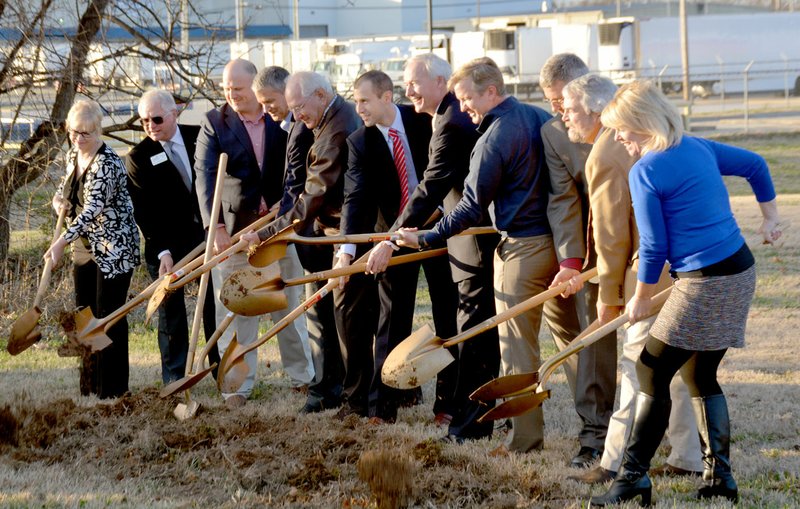 Michael Burchfiel/Siloam Sunday Members of Simmons, City and State staff did the honor of ceremonially turning dirt on the new Simmons Feed plant. The new facility, located near the intersection of Hico Street and Ashley Street, will produce pet food ingredients.