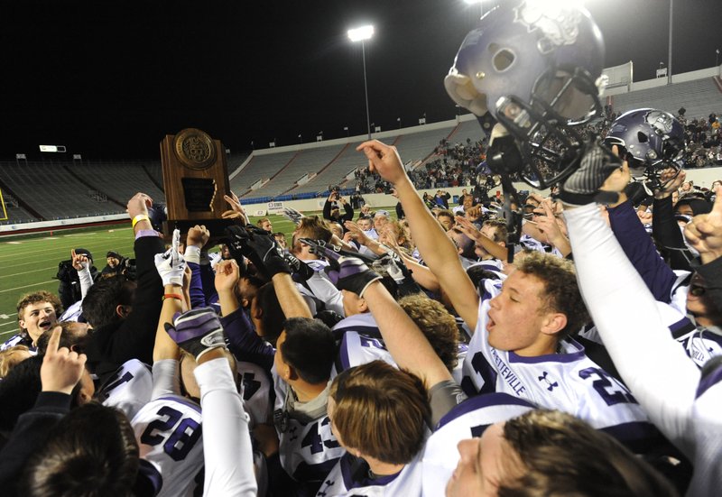 Fayetteville players celebrate their 28-7 win Dec. 5 over Springdale Har-Ber in the Class 7A state championship game at War Memorial Stadium in Little Rock. 