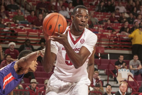 Arkansas' Willy Kouassi (50) gets the rebound against Evansville in the first half Tuesday, Dec. 8, 2015, at Bud Walton Arena in Fayetteville.