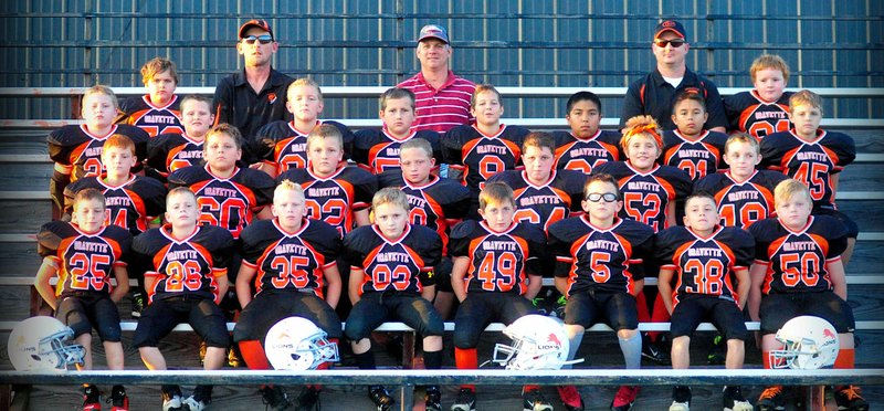 Submitted Photo The fourth-grade Gravette Lions took the Northwest Arkansas Youth Football championship this year. They played and beat the undefeated Elkins Elks, 14-8, and are the first Gravette team to win a championship since Gravette moved to the Arkansas league in 2014. The team&#8217;s overall season record was 8-1. On the team are: Talon Engleman (front, left), Jake Mayo, Holden Betz, Garrett Merworth, David Alexander, Dominic Orozco, Quinten Motsinger, Peyton Greer, Ian Leonard (row two, left), Clayton Nall, Logan Ehrhart, Hunter Anderson, Parker Hendricks, Savanna Thurman, Sabin Woolard, Kyler Austin (row,three, left), Levi Coffelt, Logan Beaver, AJ Davis, Isaac Donnell, Koda King, Triton King, Charlie Furlow, Jake Weeks (row four, left), head coach Paul Ehrhart, coach Brett Nall, coach Jason Merworth, Jerry Lee Waeltz, and not pictured are coach Kyle Austin and coach Josh Greer.