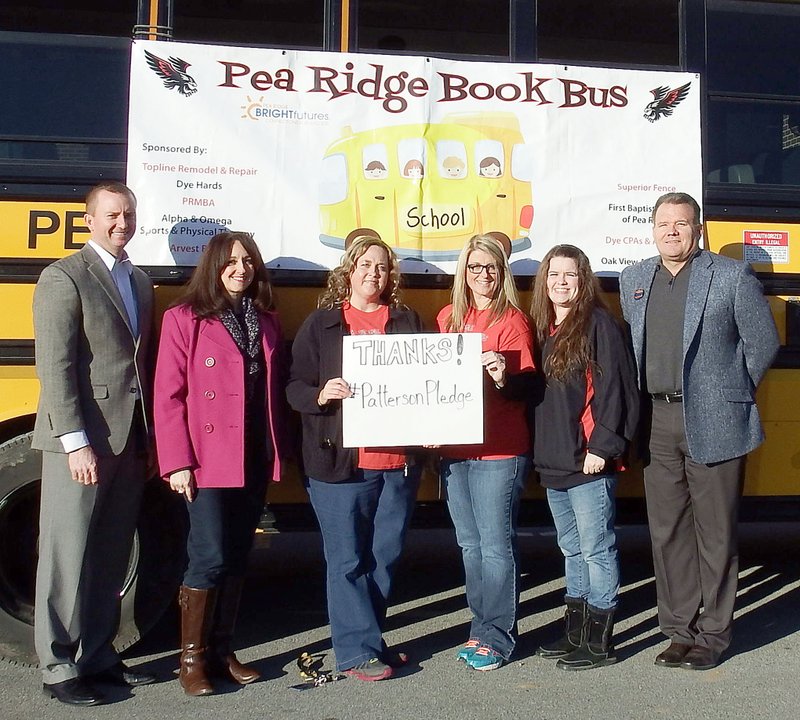 TIMES photograph by Annette Beard Gratefully accepting the grant from author James Patterson, were members of the Pea Ridge school staff, from left: Aaron Gaffigan, Primary school principal; Sarah Stokes, Intermediate School principal; Ashley Clark, Tracy Hager, Shannon Brown, teachers, and Rick Neal, superintendent.