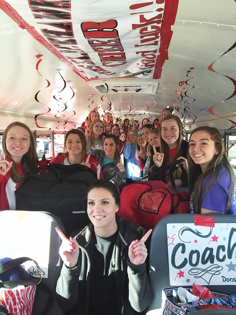 Photograph courtesy of Veronica Cotton Blackhawk cheerleaders won first place in state competition Saturday. Simple Simons Pizza and Community First Bank donated pizzas for the girls who were treated to a breakfast Friday before they loaded the decorated bus for the trek to Little Rock. Cheer coaches are Noelle Littrell-Webb and Casey Donson.