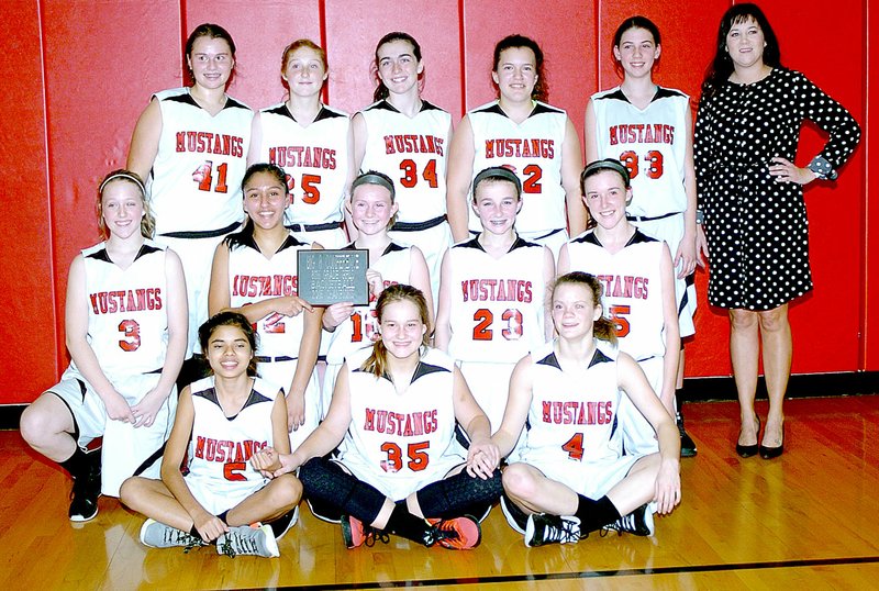 Photo by Rick Peck The McDonald County eighth-grade girls basketball team capped a 14-0 season with a 48-32 win over Monett in the championship game of the Big 8 Conference Eighth Grade Girls Basketball Tournament. Shown are: front row from left, Alexia Estrada, Mylea Schlessman and Chloe Colvin; middle row from left, Jessica Lathem, Rita Santillan, Grace Poland, Emily Thornton and Ragan Wilson; and back row from left, Jaylie Sanny, Addy Mick, Jackie Grider, Alison Nicoletti, Sammi Dowd and Coach Ashlie Martin.