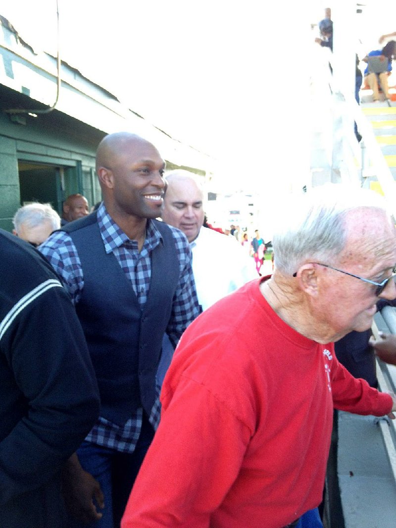 Torii Hunter (center), who retired from Major League Baseball in October, made a return to his hometown of Pine Bluff on Thursday to accept a plaque to celebrate his induction into the Pine Bluff Junior Babe Ruth Hall of Fame.

