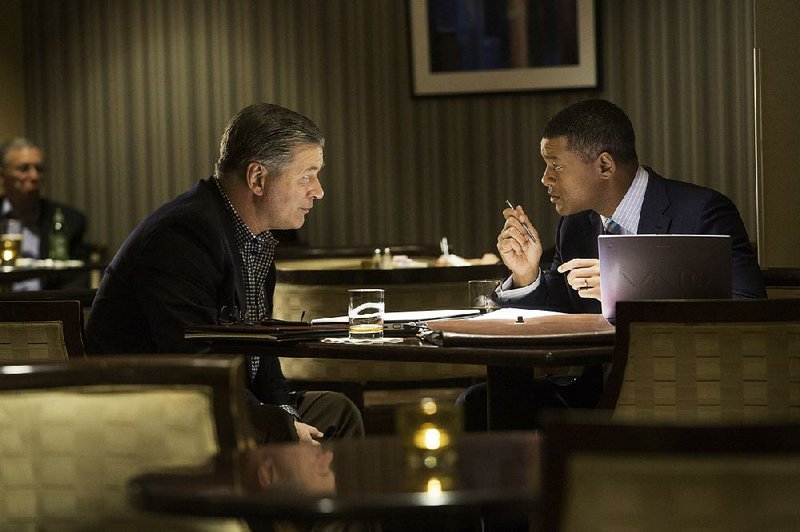 Dr. Julian Bailes (Alec Baldwin) confers with Dr. Bennet Omalu (Will Smith) in Peter Landesman’s cautionary tale about willful ignorance and head trauma, Concussion.