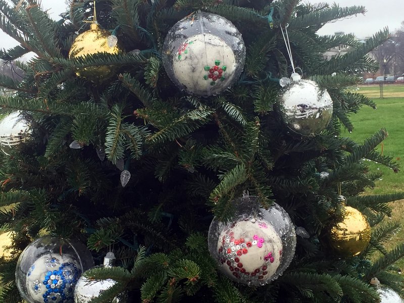 Ornaments depicting tile designs at Hot Springs bathhouses, created by Hot Springs artist Barbara Cade, adorn the state’s Christmas tree near the National Christmas Tree in Washington, D.C.