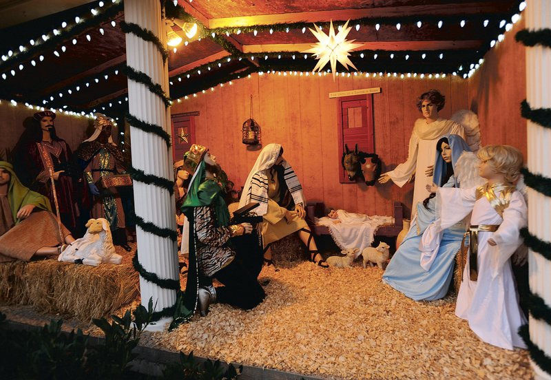 A life-size Nativity scene graces the porch of the rectory of St. Mary’s Catholic Church in Siloam Springs. The Rev. Salvador Marquez-Munoz, priest of the church, sets the scene every year to remind people to “keep Christ in Christmas.”