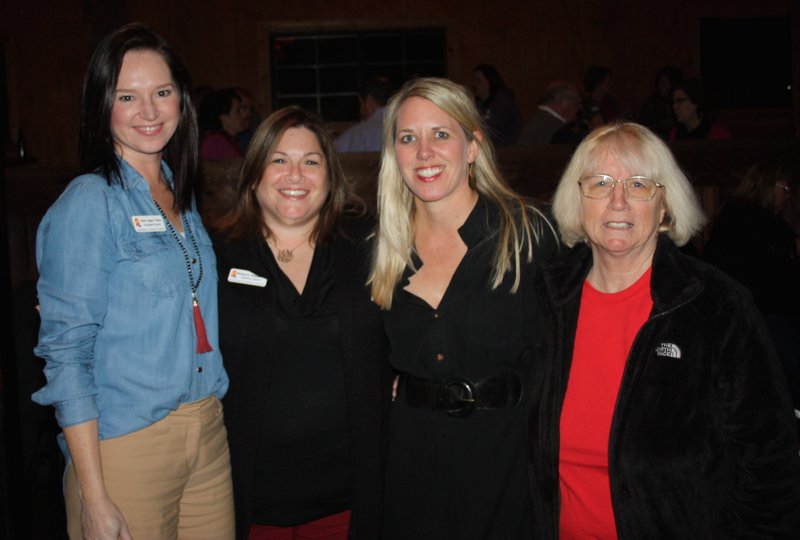 Emily Rappe Fisher (from left), Elizabeth Shackelford, Michelle Winn and Carolene Thornton enjoy the Bikes, Blues & BBQ awards party Dec. 7 at George’s Majestic Lounge in Fayetteville.