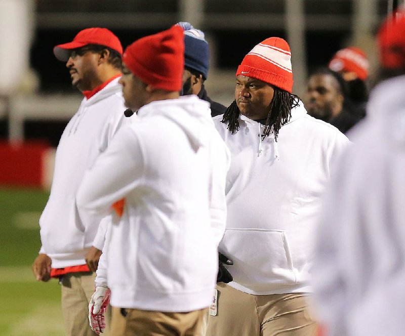 Little Rock McClellan Coach Maurice Moody (right) took the Crimson Lions from a one-victory team in 2013 to one in 2015 that played for the Class 5A state championship and had a halftime lead over eventual-champion Pulaski Academy. 