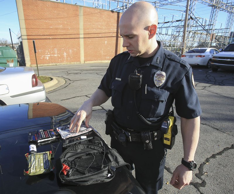 Little Rock police officer Richard Hilgeman describes the contents of the emergency medical kits carried by officers in the department.