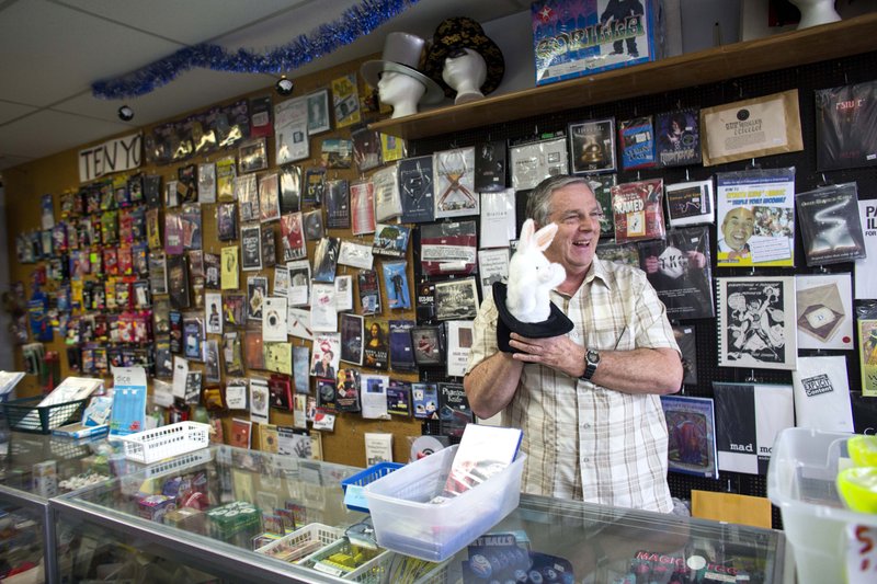 Jim Henson shows off a rabbit in a hat puppet Dec. 21 in his shop, Mr. Magic & Novelties in Little Rock. Long one of the nation’s largest magicians’ supply sources, the store will close Thursday.