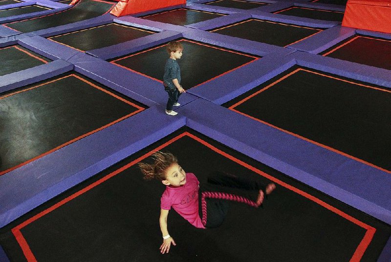 Braia Pasley of Searcy flips on a trampoline during a recent visit to Altitude Trampoline Park in Little Rock with her grandmother.