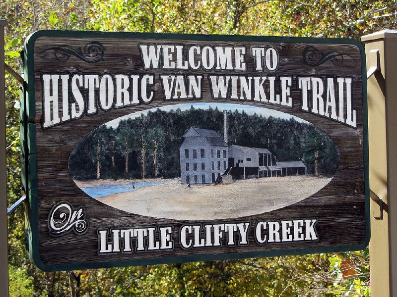A marker at Hobbs State Park-Conservation Area directs visitors to Historic Van Winkle Trail, site of a 19th-century sawmill. 
