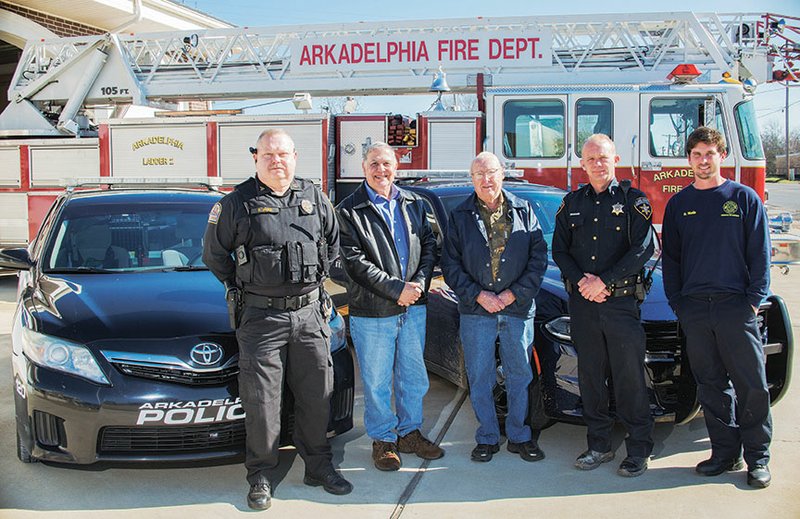 Kenneth “Sandy” Sandifer, center, and Raouf Halaby, second from left, are among those planning the Clark County Public Safety and Emergency Personnel Appreciation Dinner for Jan. 21 at the Arkadelphia Recreation Center. Representing some of the public-safety organizations that have been invited to the dinner are, from left, Sgt. Robert Jones of the Arkadelphia Police Department, Sgt. Robbie Plyler of the Clark County Sheriff’s Department and Ryan Wade, far right, a firefighter with the Arkadelphia Fire Department.