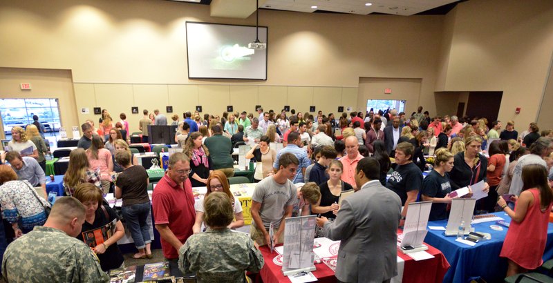 Benton County students and their families talk with college representatives on Monday Sept. 14, 2015 during the annual Benton County College Fair hosted by Northwest Arkansas Community College in Bentonville.